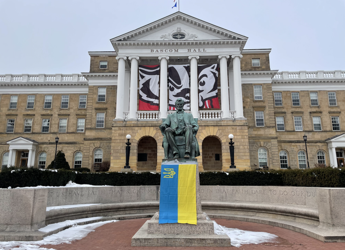 A Ukrainian flag hangs on the statue of Abraham Lincoln in front of Bascom Hall.